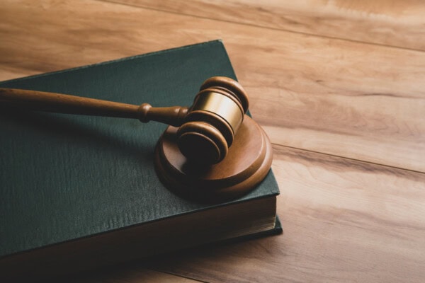 wooden judge gavel and legal book