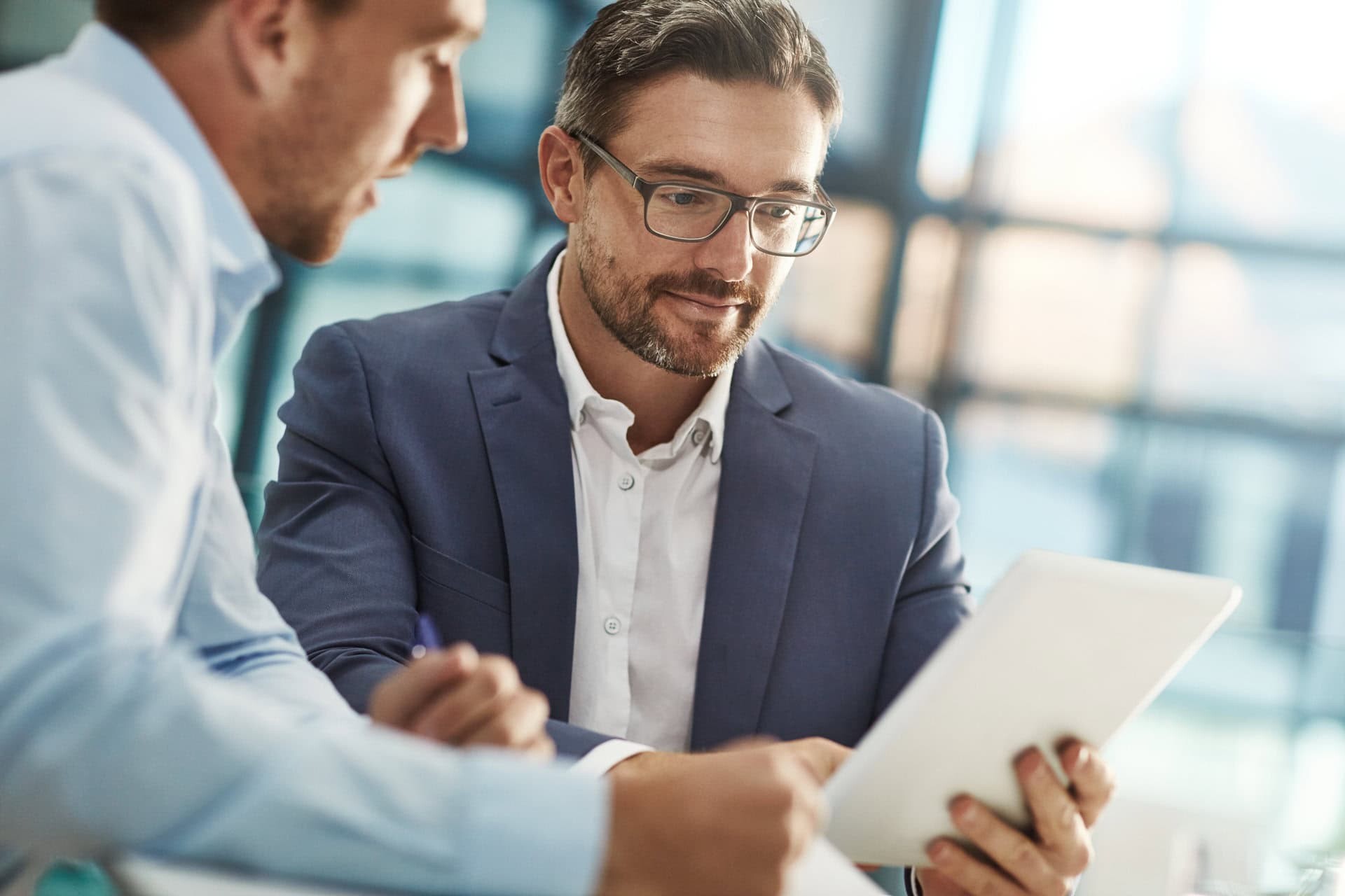 Meeting, teamwork and business people with tablet in office workplace.